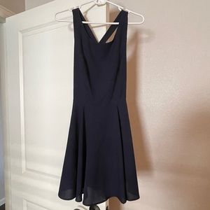 Size medium dress from Double Zero. Skater dress fit w/ accent bow on back.